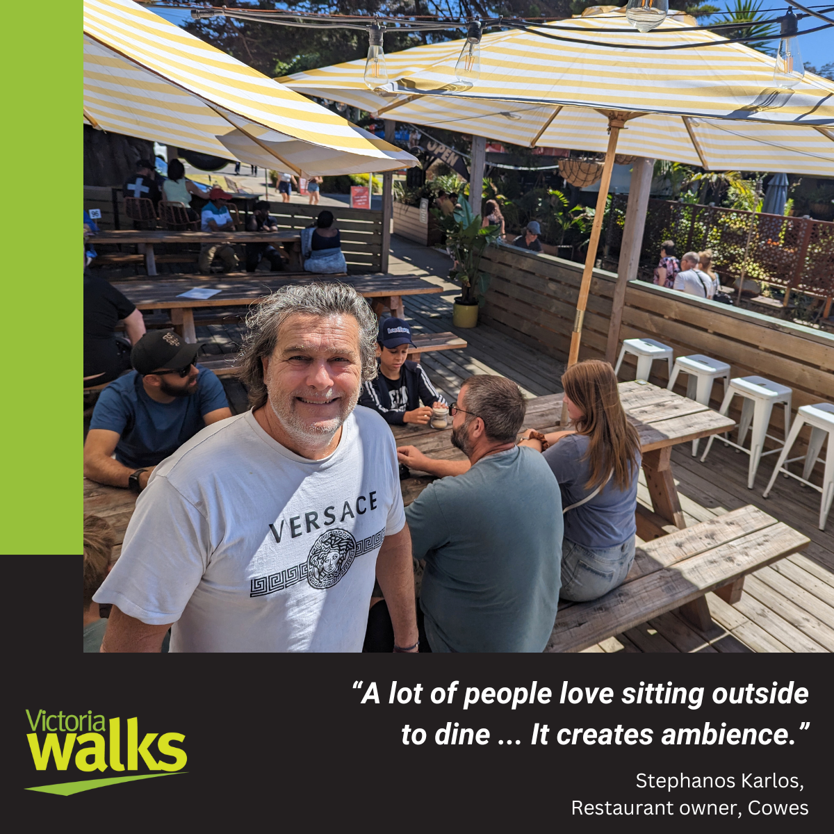 Restaurant owner Stephanos talks about his outdoor dining space. Photo by Victoria Walks.